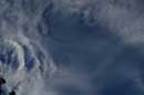 Newly formed clouds with uniform droplet size start to iridesce as they move near the sun (lower left), August 7, 2004 -  2004 Lauri Kangas